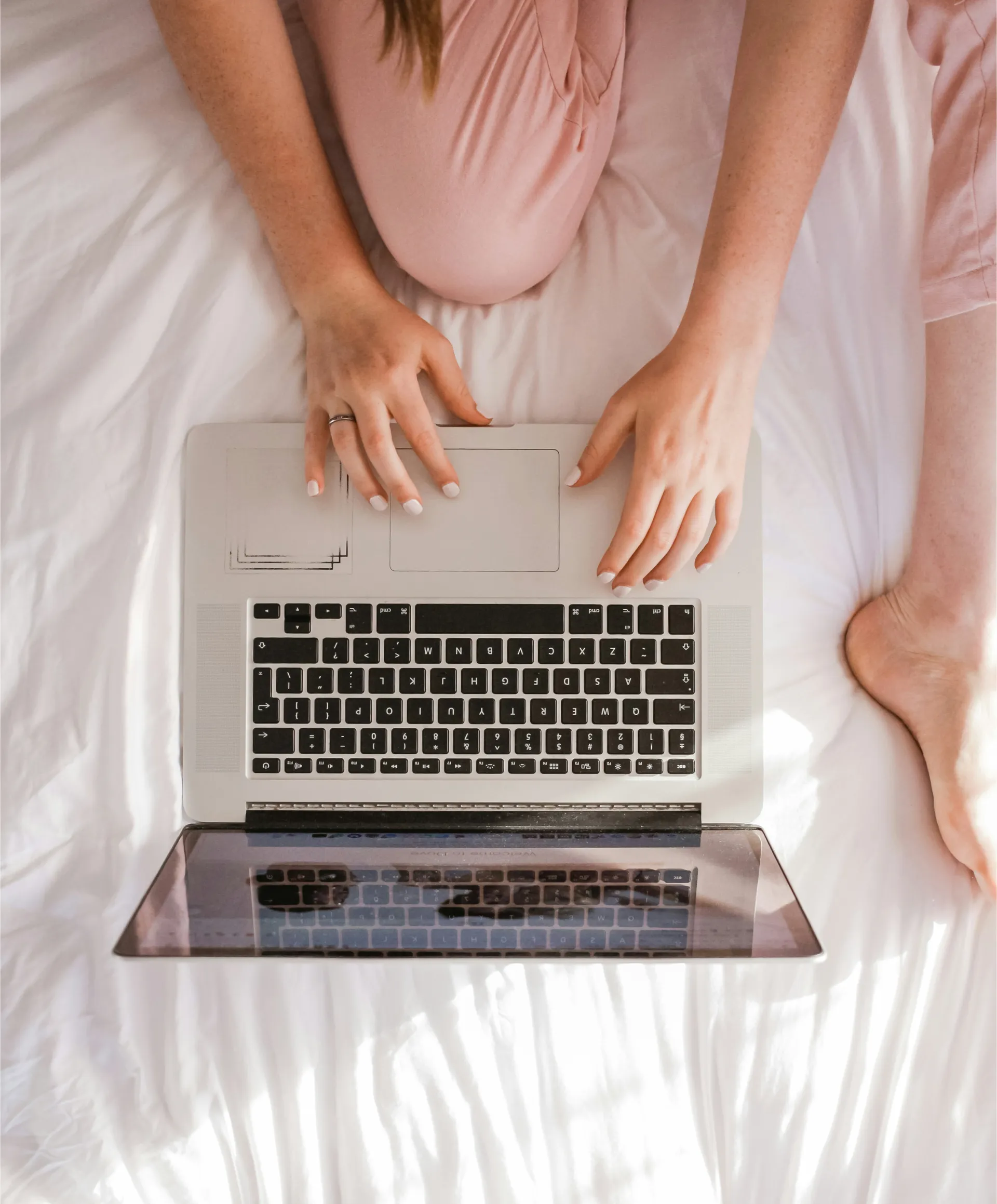 A participant managing their NDIS plan on a laptop at home